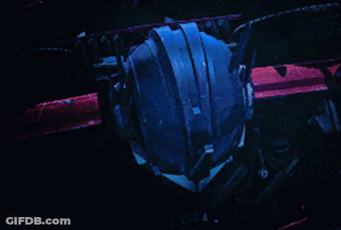 Close Up Robot Face With Blue Eyes GIF