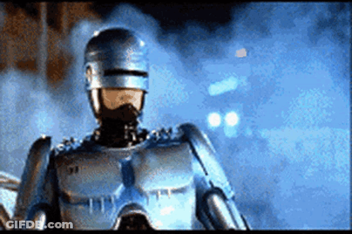 Close Up Robot Wearing Helmet And Mask GIF