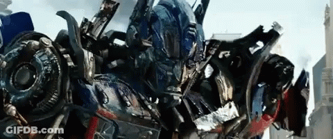 Close Up Robot With Helmet In Front Of City GIF