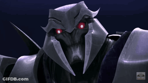 Close Up Robot With Red Eyes Transformers GIF