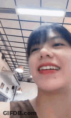 Close Up Smiling Face With Ceiling Background GIF
