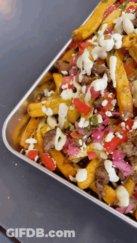Close Up Tray Of Food With Toppings GIF