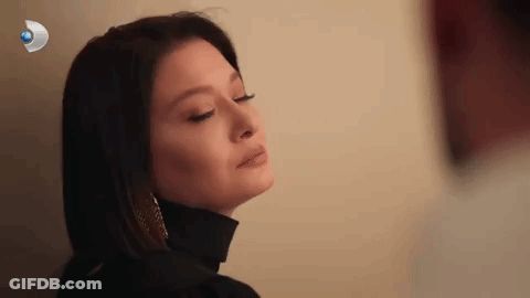 Close-Up Woman Eyes Closed Black Turtleneck Earrings GIF