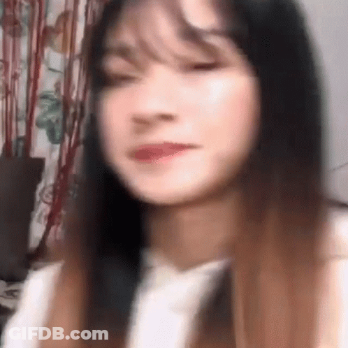 Close-Up Woman Eyes Closed Blurred Background GIF