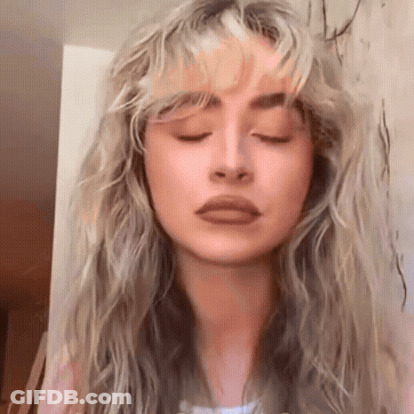 Close-Up Woman Eyes Closed Hair Blowing GIF