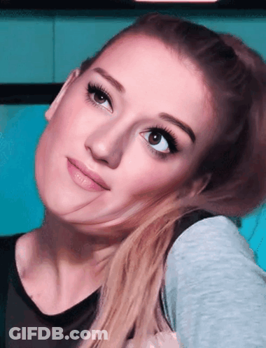 Close Up Woman Face Blue Background GIF