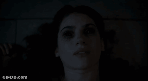 Close-Up Woman Face With Dark Background GIF