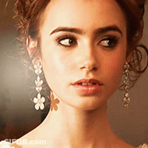 Close-Up Woman Face With Earrings GIF