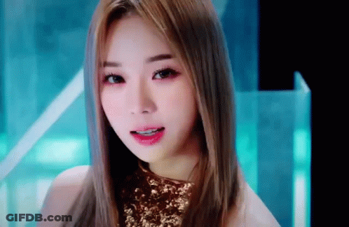 Close Up Woman Face With Long Hair And Gold Top GIF