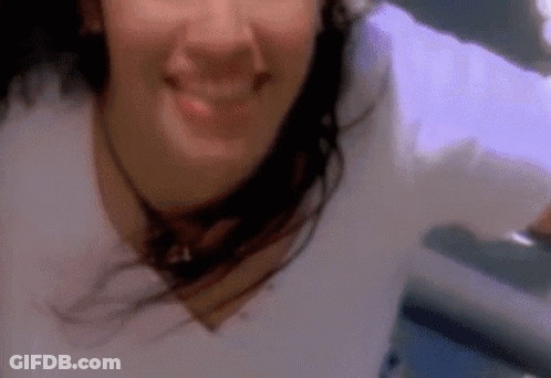 Close Up Woman Hair Blowing In Wind Smiling GIF