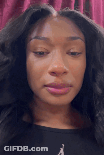 Close Up Woman In Black Shirt With Letter R GIF