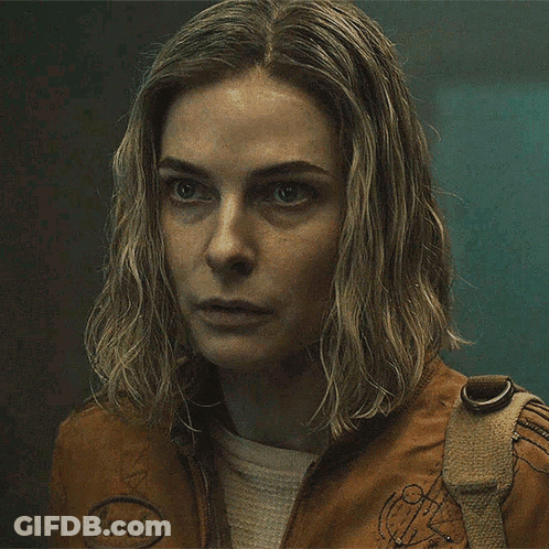 Close Up Woman In Brown Jacket With Badge GIF