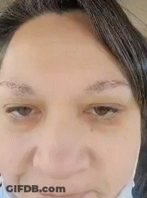 Close-Up Woman In Mask GIF
