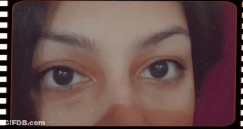 Close Up Woman's Eyes In Film Strip Frame GIF