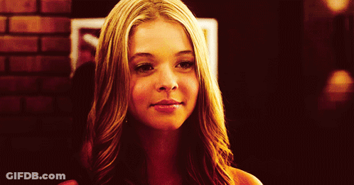 Close Up Woman's Face Brick Wall GIF