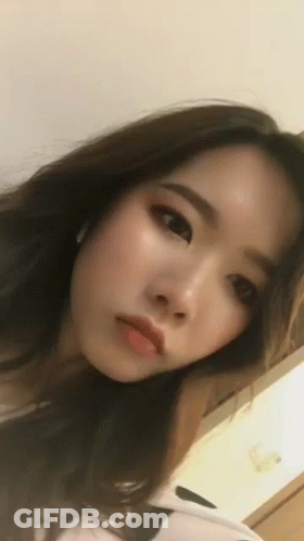 Close Up Woman's Face Looking At Camera GIF