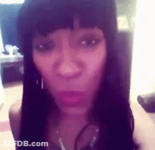 Close Up Woman's Face Purple Background GIF