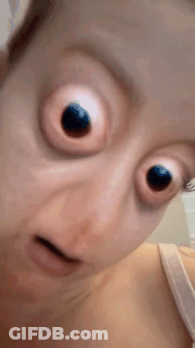 Close Up Woman's Face With Big Eyes GIF