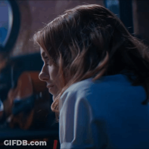 Close Up Woman's Face With Blue Light GIF