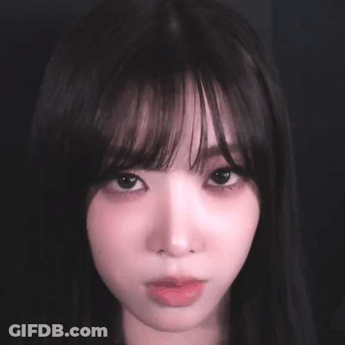 Close Up Woman's Face With Dark Hair GIF