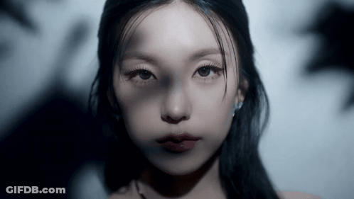 Close Up Woman's Face With Dark Hair GIF