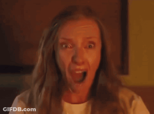 Close Up Woman's Face Yellow Background GIF