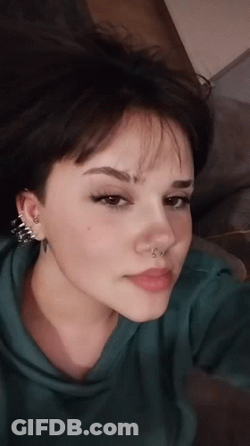 Close Up Woman's Pierced Face GIF