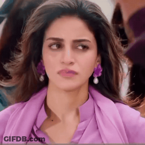 Close Up Woman Wearing Purple Earrings GIF