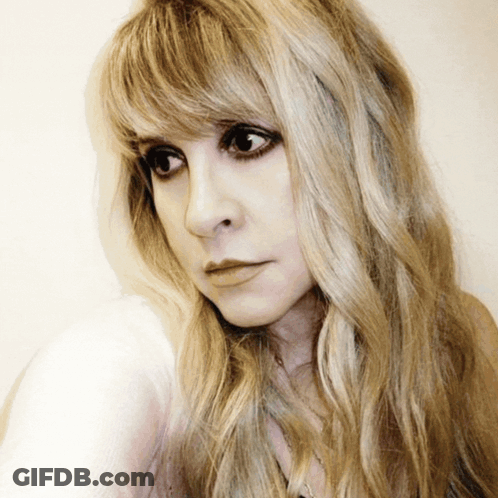 Close Up Woman With Long Blonde Hair And Bangs GIF