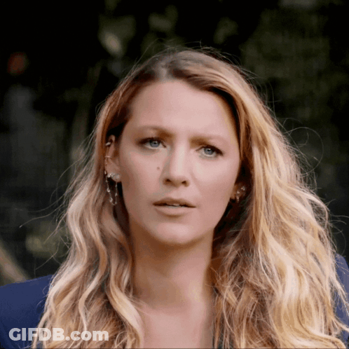 Close Up Woman With Long Blonde Hair And Blue Eyes GIF