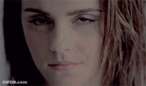 Close-Up Woman With Long Hair Looking At Camera GIF
