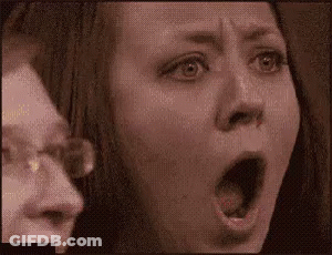 Close Up Woman With Mouth Open Man Behind GIF