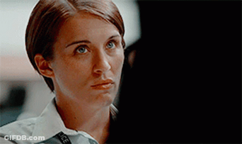 Close Up Woman With Police Badge GIF