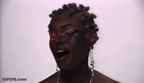 Close Up Woman With Red Eye And Earrings GIF