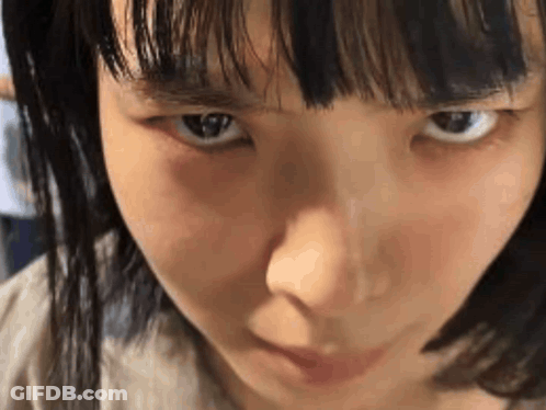 Close Up Woman With Serious Look GIF