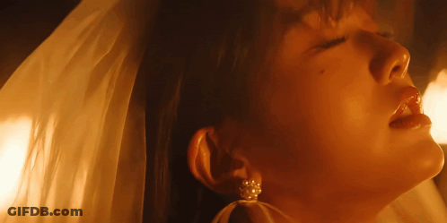 Close Up Woman With Veil And Pearl Earrings GIF
