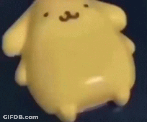 Close Up Yellow Stuffed Animal Floating On Blue Surface GIF