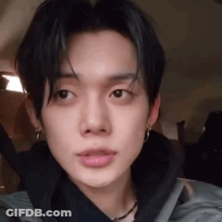 Close Up Young Man In Black Jacket With Earrings GIF