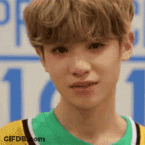 Close Up Young Man In Yellow And Green Shirt GIF