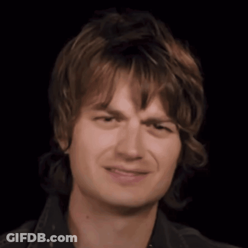 Close Up Young Man's Face Black Background GIF