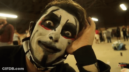 Clown Face Man Holding ABC Radio Sign GIF