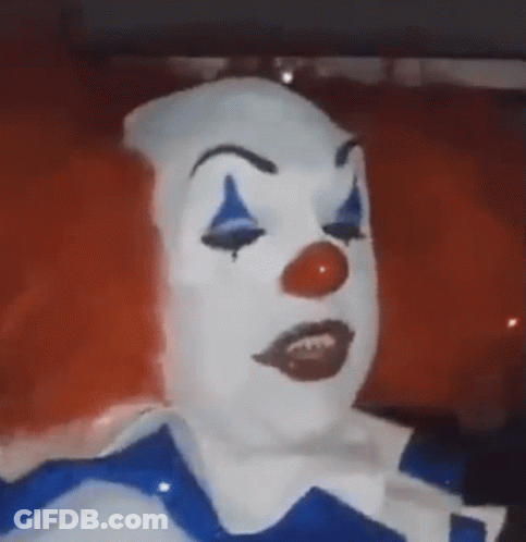 Clown Face With Red Hair And Blue Eyes GIF