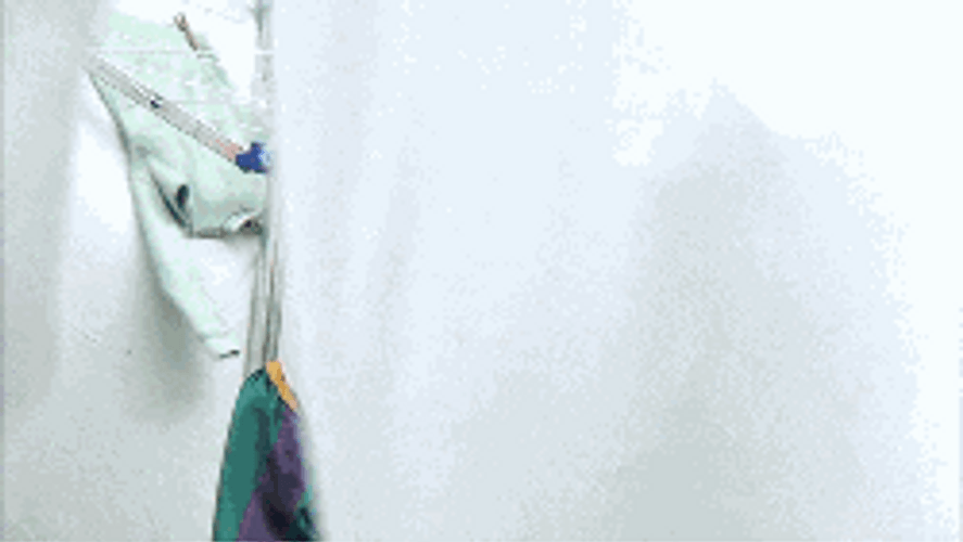 Clown Hiding In Sheets GIF