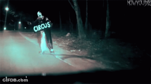 Clown Holding Circus Sign GIF
