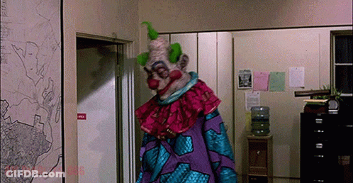 Clown In Purple And Blue Costume GIF