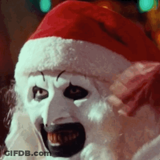 Clown In Santa Hat And White Mask GIF