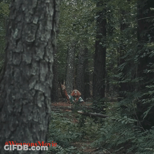 Clown In The Woods With Weaponsmovie In Red GIF