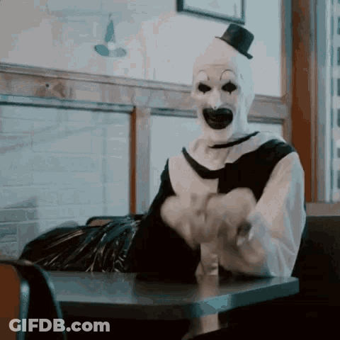 Clown In Top Hat At Diner GIF