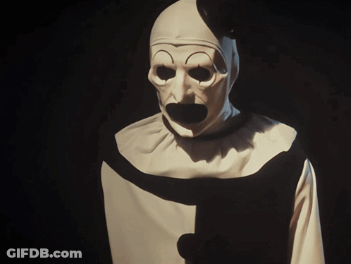 Clown In White And Black Costume With Black Collar Stripe GIF