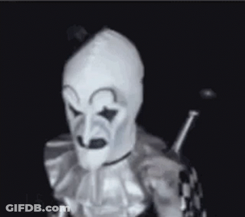 Clown In White Mask Holding Sword GIF